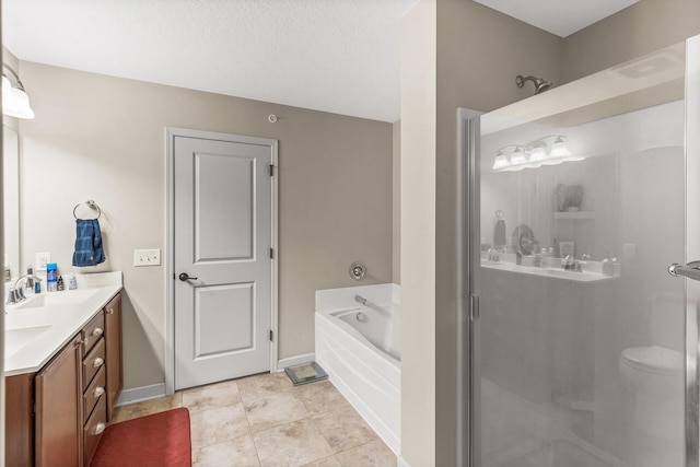 bathroom featuring tile patterned flooring, vanity, and shower with separate bathtub