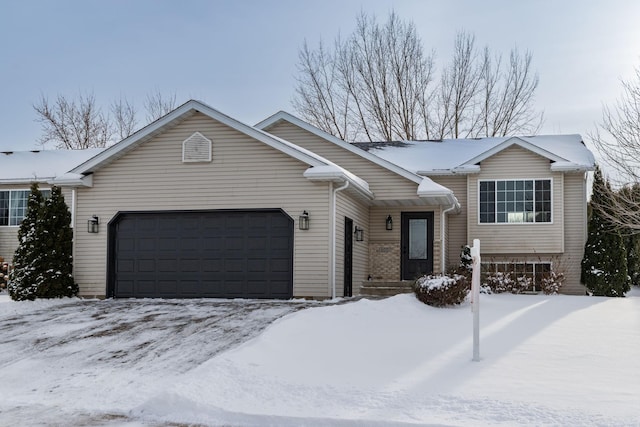 view of front of property with a garage