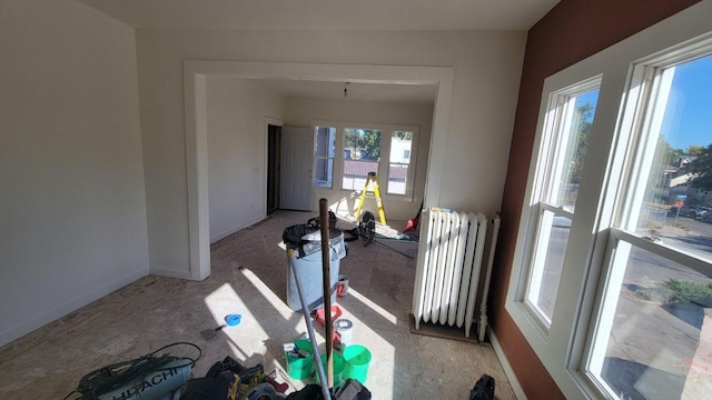 interior space featuring a healthy amount of sunlight and radiator