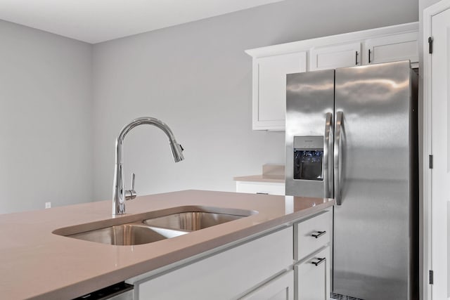 kitchen featuring white cabinetry, sink, and stainless steel appliances