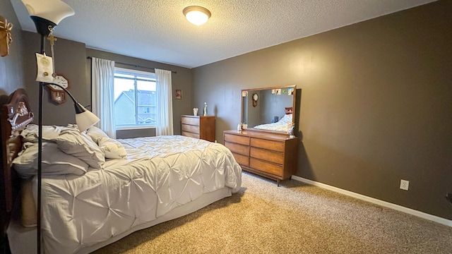 carpeted bedroom with a textured ceiling