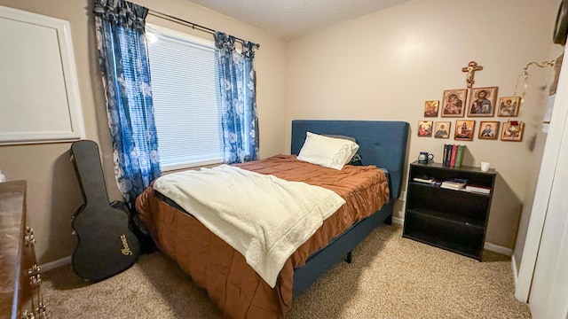 carpeted bedroom with a textured ceiling