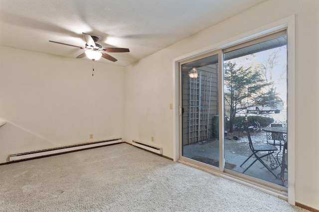 empty room with a textured ceiling, carpet floors, a baseboard radiator, and ceiling fan