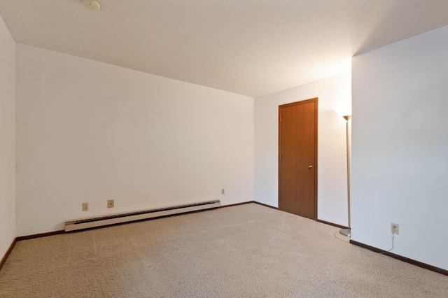 empty room with light carpet and a baseboard radiator