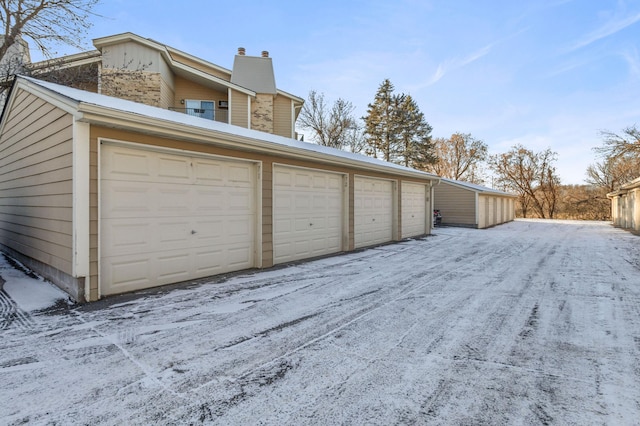 view of snow covered garage