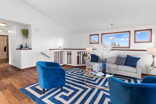 living room with dark hardwood / wood-style floors and vaulted ceiling