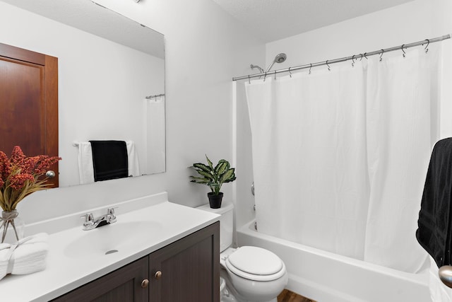 full bathroom with vanity, toilet, shower / bathtub combination with curtain, and a textured ceiling