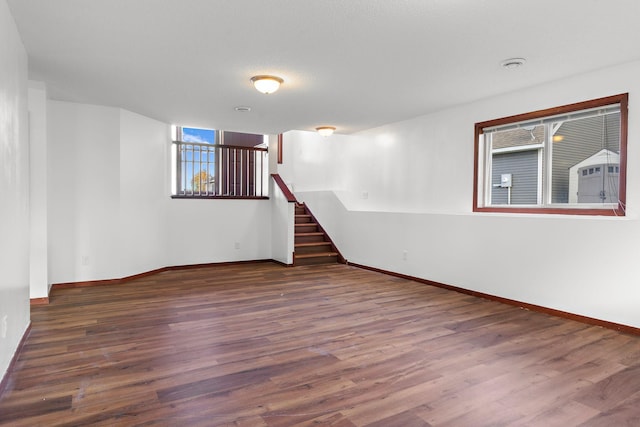 empty room featuring dark hardwood / wood-style flooring