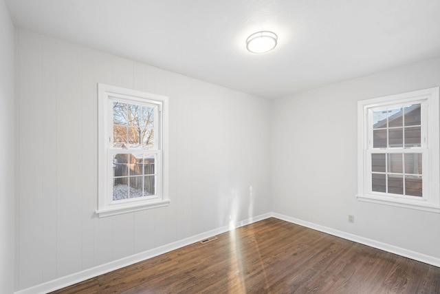 empty room featuring hardwood / wood-style flooring