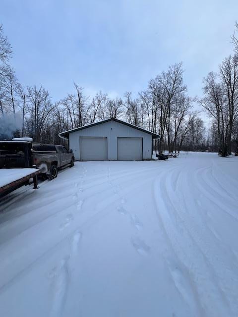 view of snow covered garage