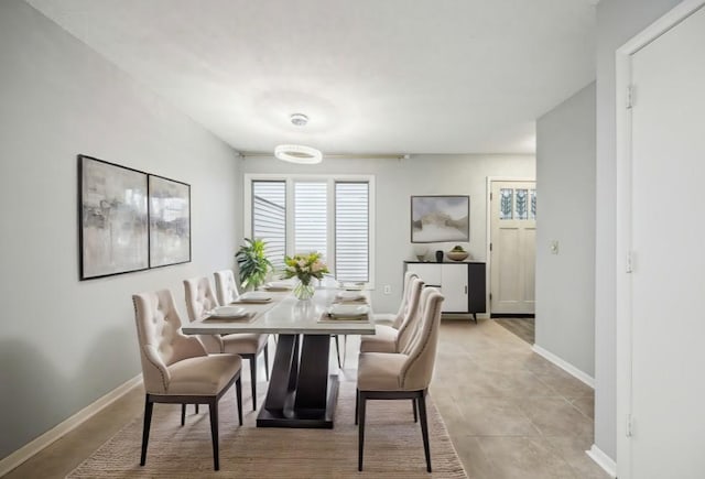 dining area with light tile patterned floors