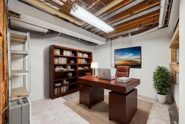 office featuring brick wall