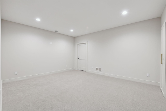 spare room with light carpet