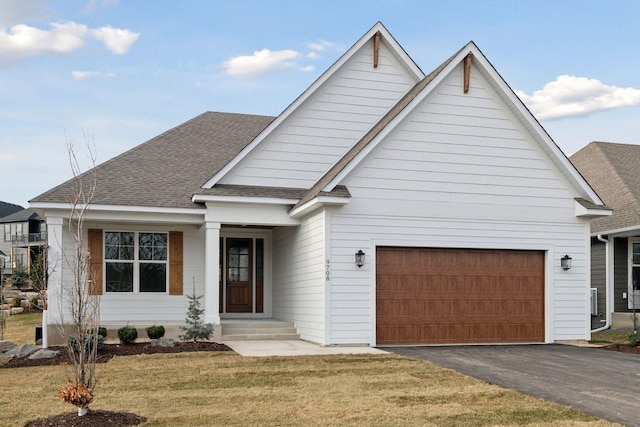 view of front facade with a garage and a front yard