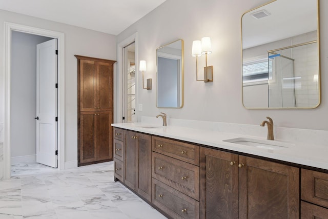 bathroom with vanity and a shower with shower door