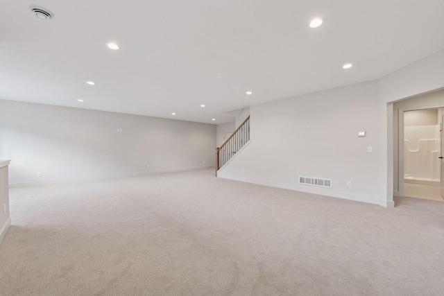 interior space featuring light carpet