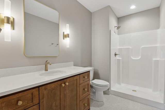 bathroom featuring a shower, tile patterned floors, vanity, and toilet