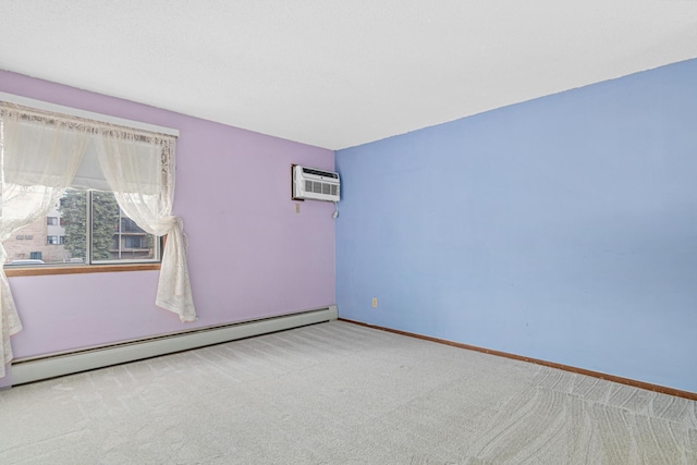 empty room with light colored carpet, a wall mounted AC, and a baseboard radiator