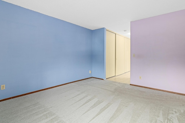 spare room with light carpet