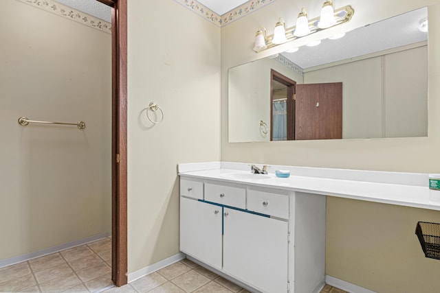 bathroom with tile patterned flooring and vanity