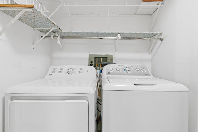 laundry room with separate washer and dryer