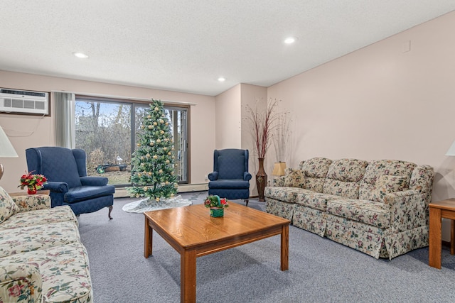 carpeted living room featuring a textured ceiling and a wall unit AC