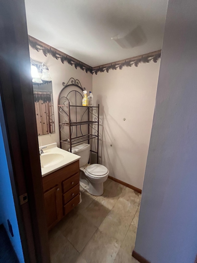 bathroom with vanity and toilet