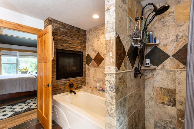 bathroom with plus walk in shower, wood-type flooring, and a textured ceiling