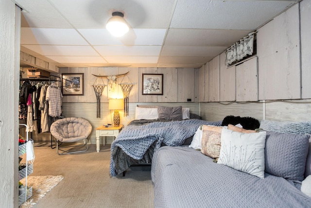 bedroom with a paneled ceiling and a closet