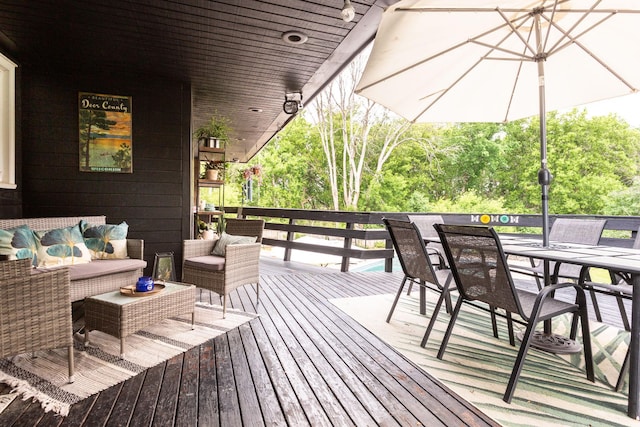 wooden deck with an outdoor hangout area