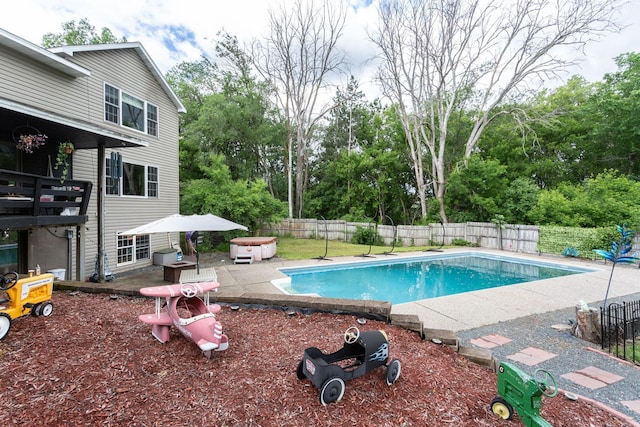 view of swimming pool with a patio