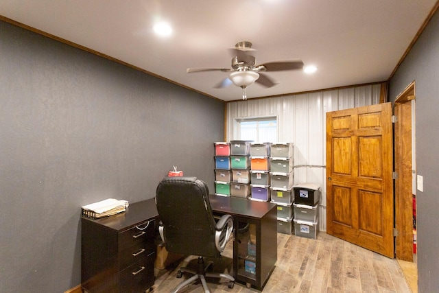 office area featuring ceiling fan, light wood-type flooring, and crown molding