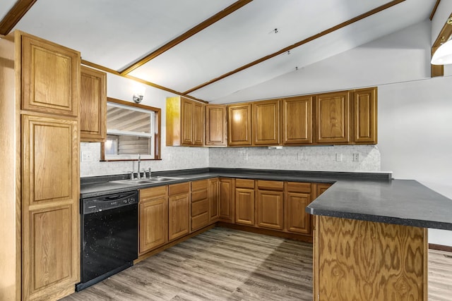 kitchen with decorative backsplash, kitchen peninsula, vaulted ceiling, sink, and black dishwasher