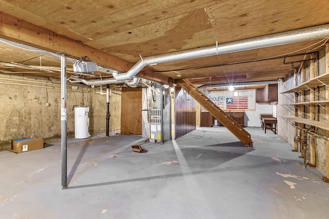 basement with heating unit and electric water heater