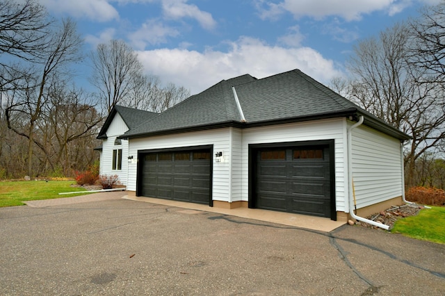 view of property exterior with a garage