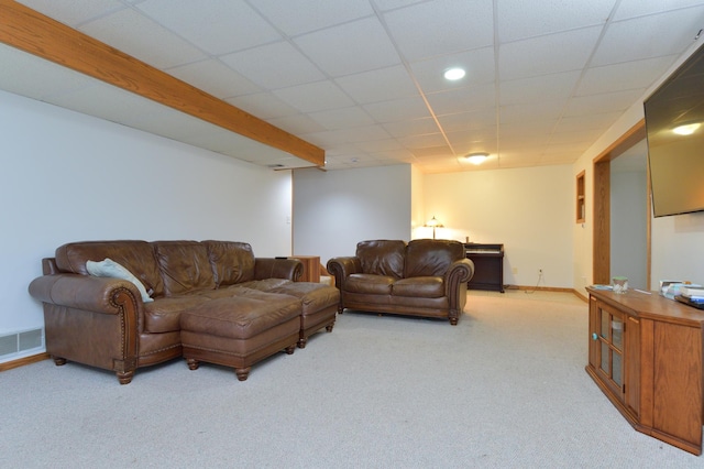 living room with carpet floors and a paneled ceiling