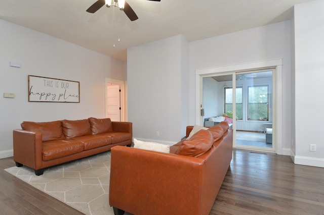 living room with hardwood / wood-style flooring and ceiling fan