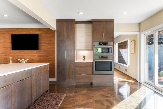 kitchen with stainless steel double oven, recessed lighting, modern cabinets, and light countertops