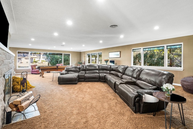 living area featuring visible vents, baseboards, carpet floors, recessed lighting, and a fireplace