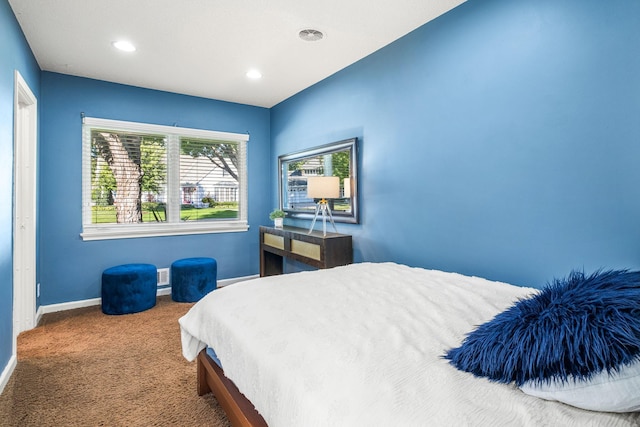 carpeted bedroom featuring recessed lighting and baseboards