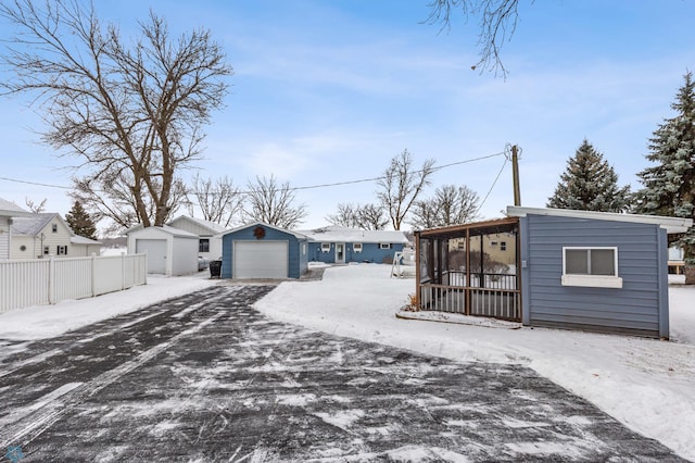 view of front of house featuring an outbuilding and a garage