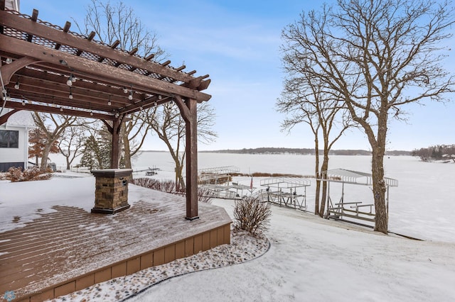 exterior space with a pergola and a water view