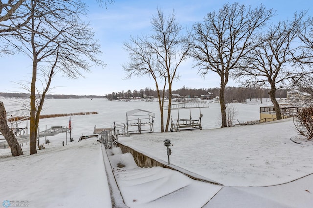 yard layered in snow with a rural view