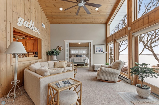 carpeted living room featuring ceiling fan, wood ceiling, high vaulted ceiling, and a baseboard heating unit