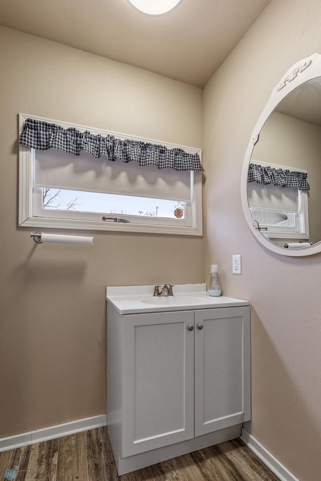 bathroom featuring hardwood / wood-style floors and vanity