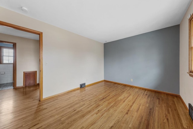 unfurnished room featuring light wood-type flooring