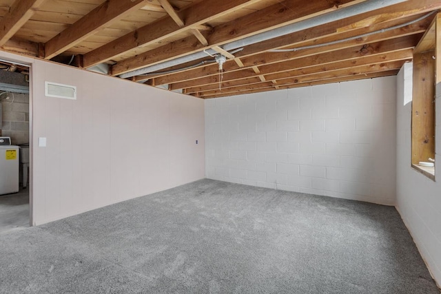 basement featuring carpet flooring and washer / clothes dryer