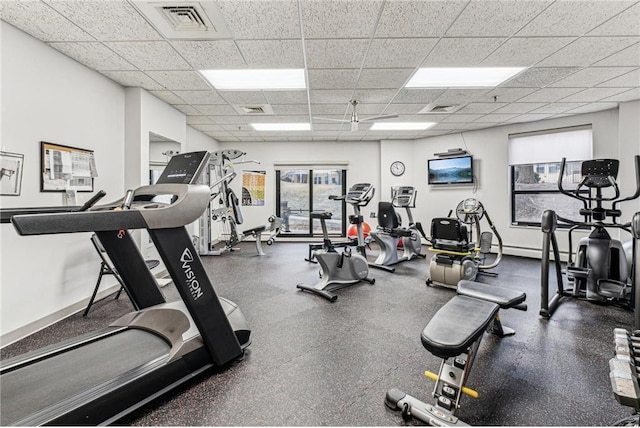 workout area with a paneled ceiling