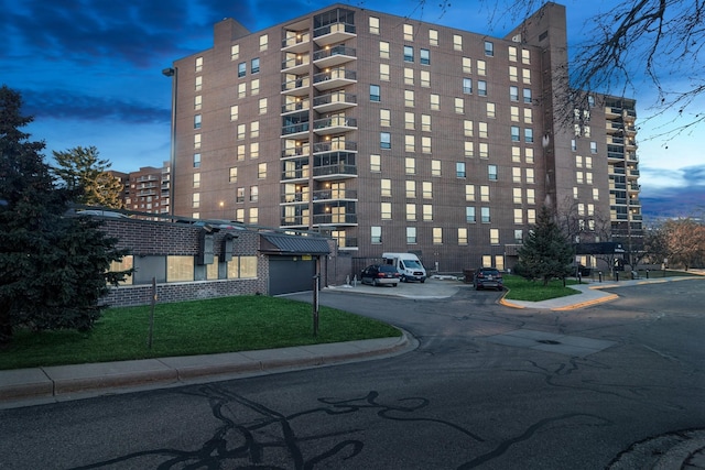 view of outdoor building at dusk