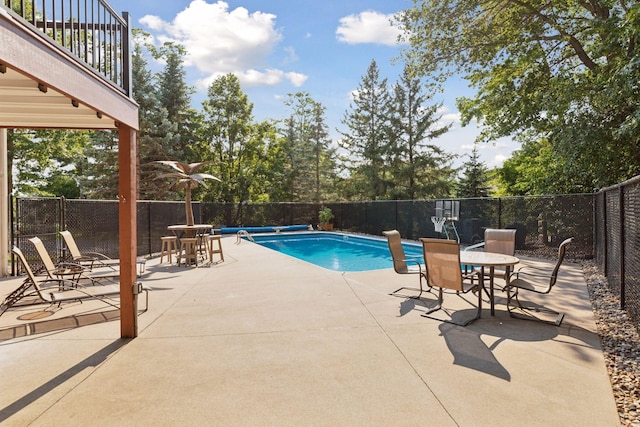 view of swimming pool featuring a patio area, a fenced in pool, and a fenced backyard